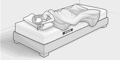 Proefslapen - een vrouw op een bed.